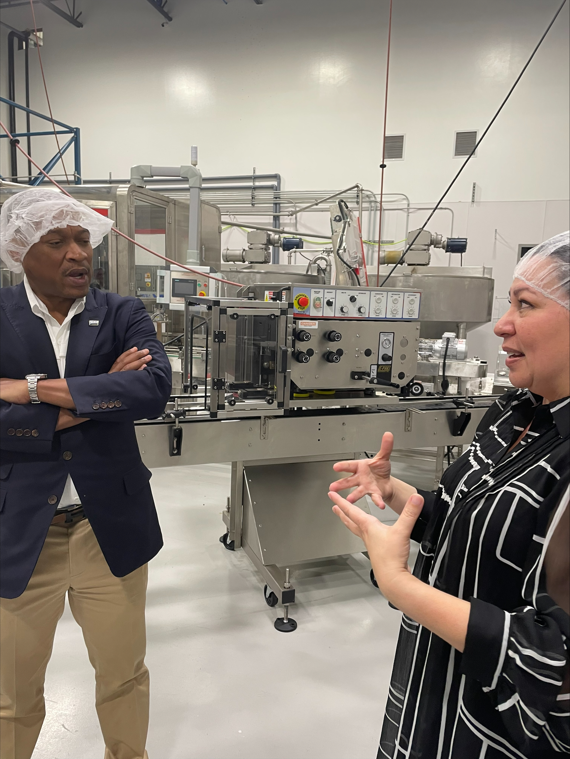 FAS Administrator Daniel Whitley chats with BNutty owner Carol Podolak inside the manufacturing facility in Portage, Indiana.