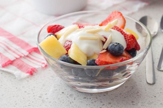 Bowl of fruit salad with yogurt.