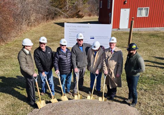 Community representatives from the Town of Torrey and USDA staff pause to break ground on the town’s first-ever Water District