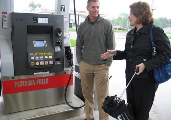 Michael Peterson, owner of Petersen Oil in Greenville, discusses flex fuel pumps at his facility with USDA Rural Business Administrator Judith Canales.
