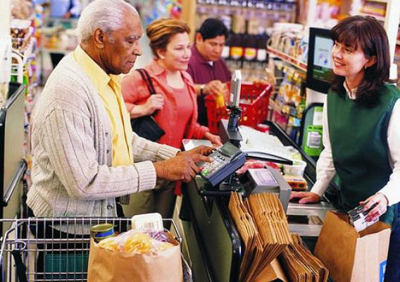 An elderly man shopping