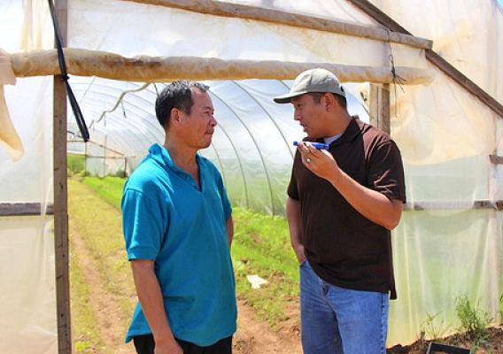 New Jersey farmer Liang Shao Hua listens to NRCS technical advisor Frank Wu provide advice in Chinese Mandarin, Liang’s native language. His limited English proficiency restricted his exposure to USDA farm programs until Tropical Storm Sandy made it necessary for Liang to connect with the department for assistance. He is now an FSA loan recipient and appreciates the cost-share benefits of the Emergency Conservation Program funds that assisted his family’s clean-up efforts.