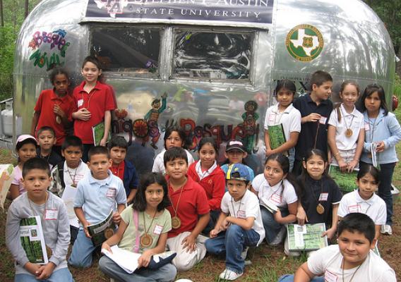More than 1,500 inner-city youth from Houston Independent School District gather over a week-long period at Jones State Forest – Children’s Forest each year to participate in the annual Exploring Houston’s Backyard. The Bosque Móvil-Forest Mobile is one tool the U.S. Forest Service’s Latino Legacy program uses to provide learning experience around Texas.