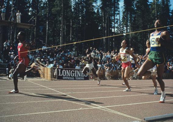 John Carlos breaks the tape and sets a world record of 19.7 seconds in the 200-meter final during the Olympic Trials in September 1968. Tommie Smith (right) placed second, and Larry Questad (red shorts and white jersey) was third. (Courtesy Track & Field News/Rich Clarkson)