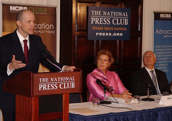 Doug O'Brien, Acting Under Secretary for USDA Rural Development addresses attendees at a National Co-op Month forum at the National Press Club in Washington, D.C. Lillian Salerno, Administrator for Rural Business & Cooperatives Programs and Charles Snyder, President of National Cooperative Bank are on the right.
