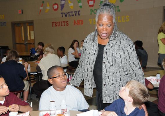 FNS Deputy Administrator for Special Nutrition Programs Audrey Rowe talks with Byram Middle School students during their lunch period following a ceremony in which their school received a HealthierUS School Challenge Gold Award on Oct 14.