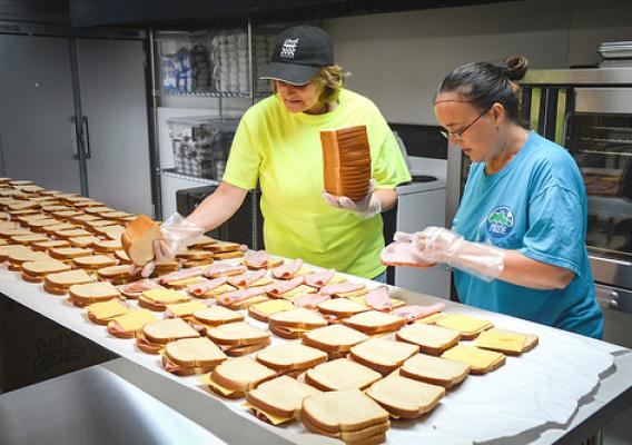 KCEOC staff, Latisha Smith (left) and Daphne Karr, preparing up to 1,800 sack lunches each day