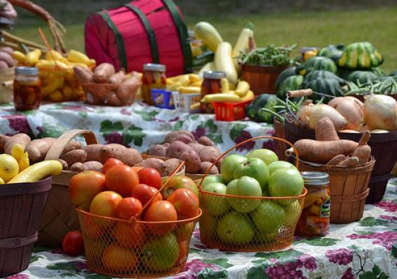 Baskets of fruits and vegetables on tables