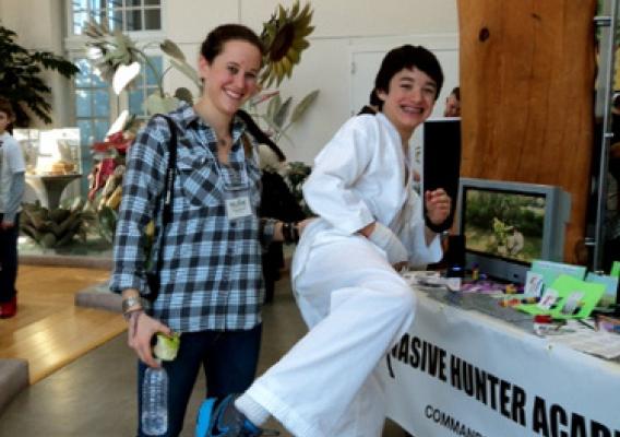 Kelsey Branch, APHIS Biologist, is pictured with “Commander” Ben Shrader, Invasive Hunter.