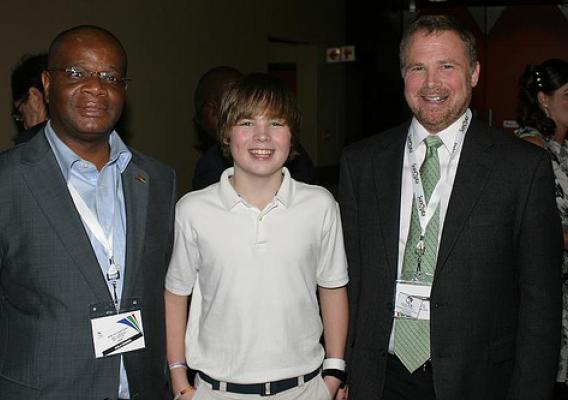 Mozambique Minister of Science and Technology Louis Pelembe (left) meets with National Soybean Research Laboratory  Director Craig Gundersen and his son, Van, during the World Soybean Research Conference earlier this year. Minister Pelembe participated in the Foreign Agricultural Service Cochran Fellowship Program and has used his training to help address critical food security and develop agricultural policy in Mozambique. (Courtesy photo)