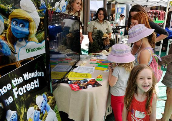 Young Smurf fans visit the Forest Service’s booth during a community outreach event promoting the Discover the Forest campaign. (U.S. Forest Service photo)