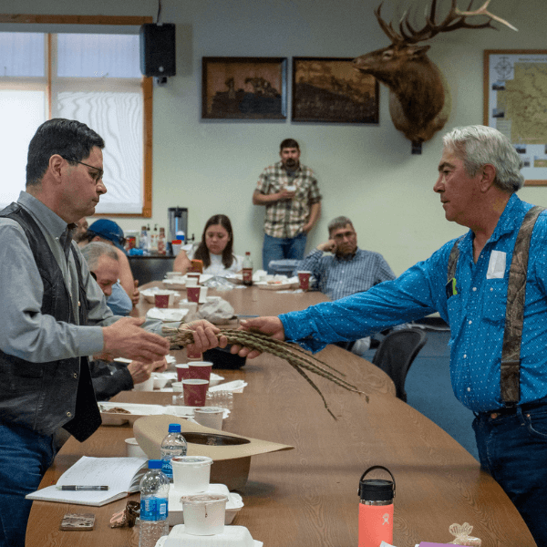 USDA’s Farm Service Agency Administrator Zach Ducheneaux is presented with Sweet Grass by Kipp Family during honoring ceremony before meeting with members of the Blackfeet Extension Stockgrowers/PHLI/Ag Producers to listen to their concerns and discuss solution they are working on to help during a meeting