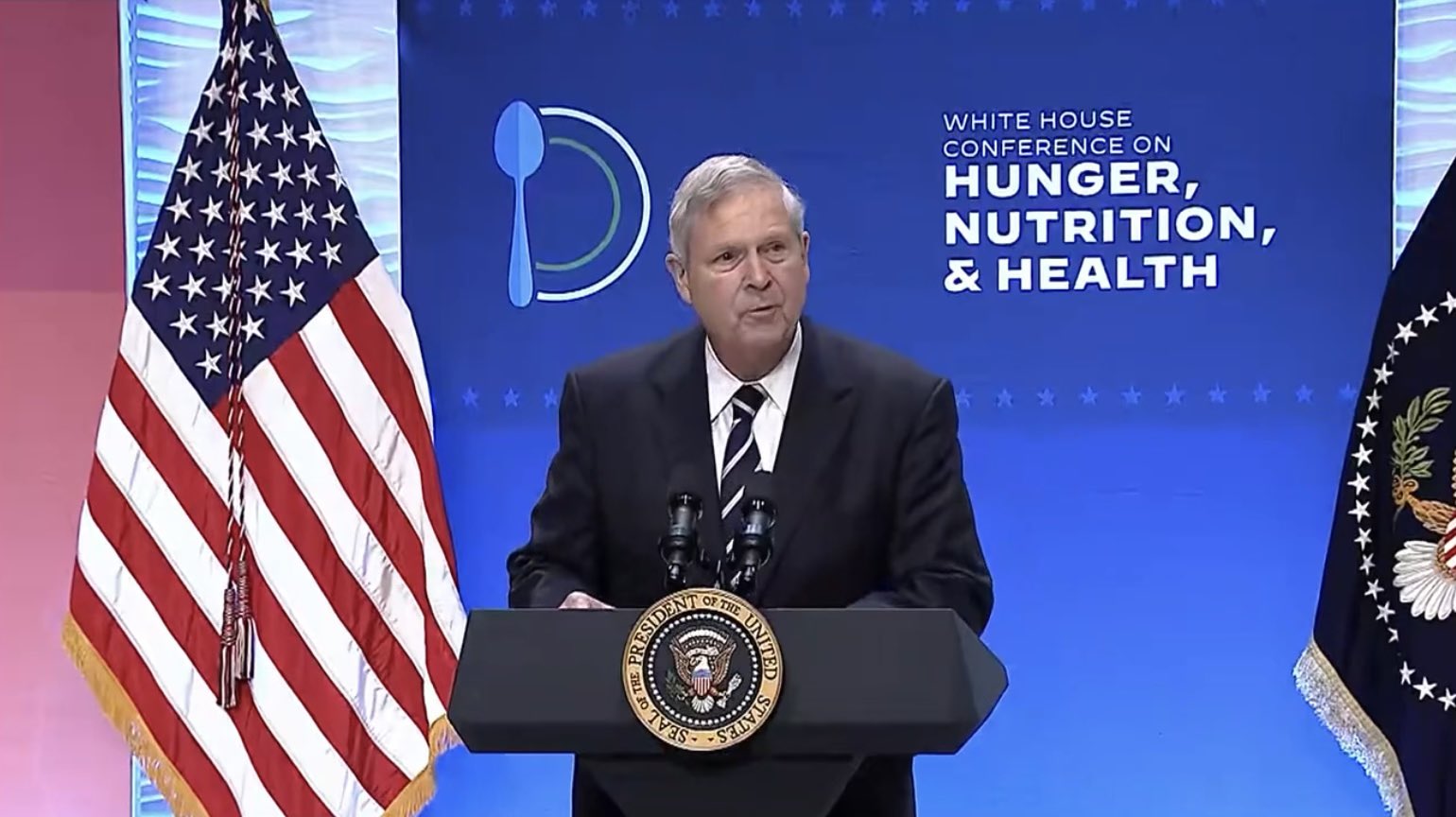 Agriculture Secretary Tom Vilsack speaking behind a podium at the White Conference on Hunger, Nutrition and Health at the Ronald Reagan Building in Washington, DC on September 28, 2022