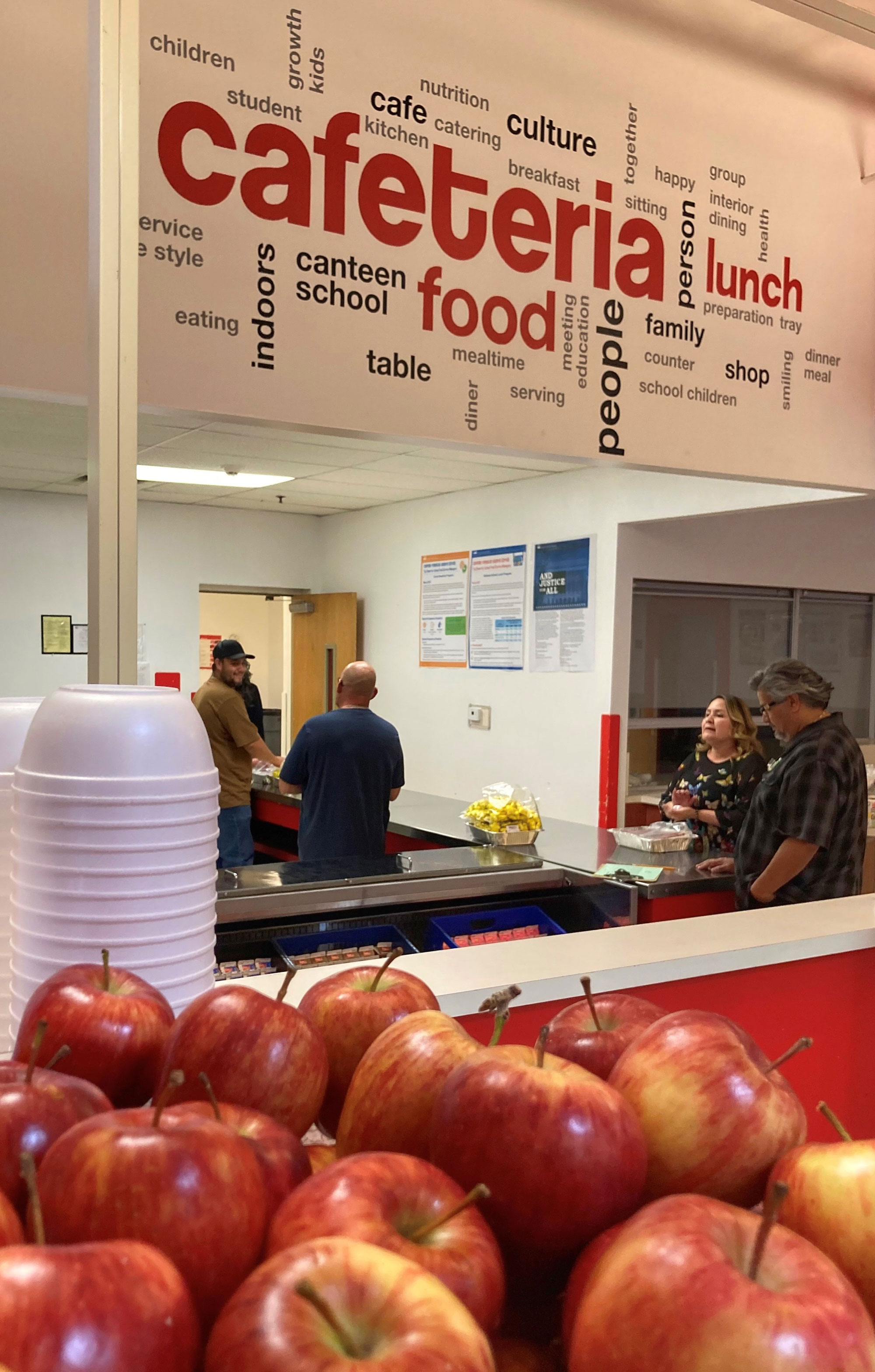 People visit a school cafeteria during lunch