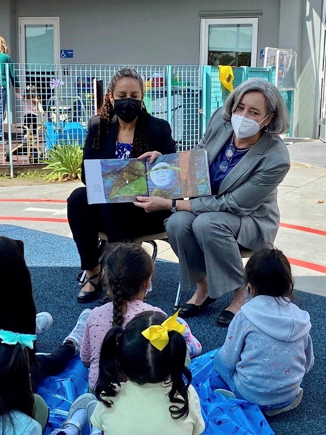 California Department of Social Services Director Kim Johnson (left) and FNCS Deputy Under Secretary Stacy Dean (right) read to 3-5 year old children enrolled in the Los Angeles County Head Start Program