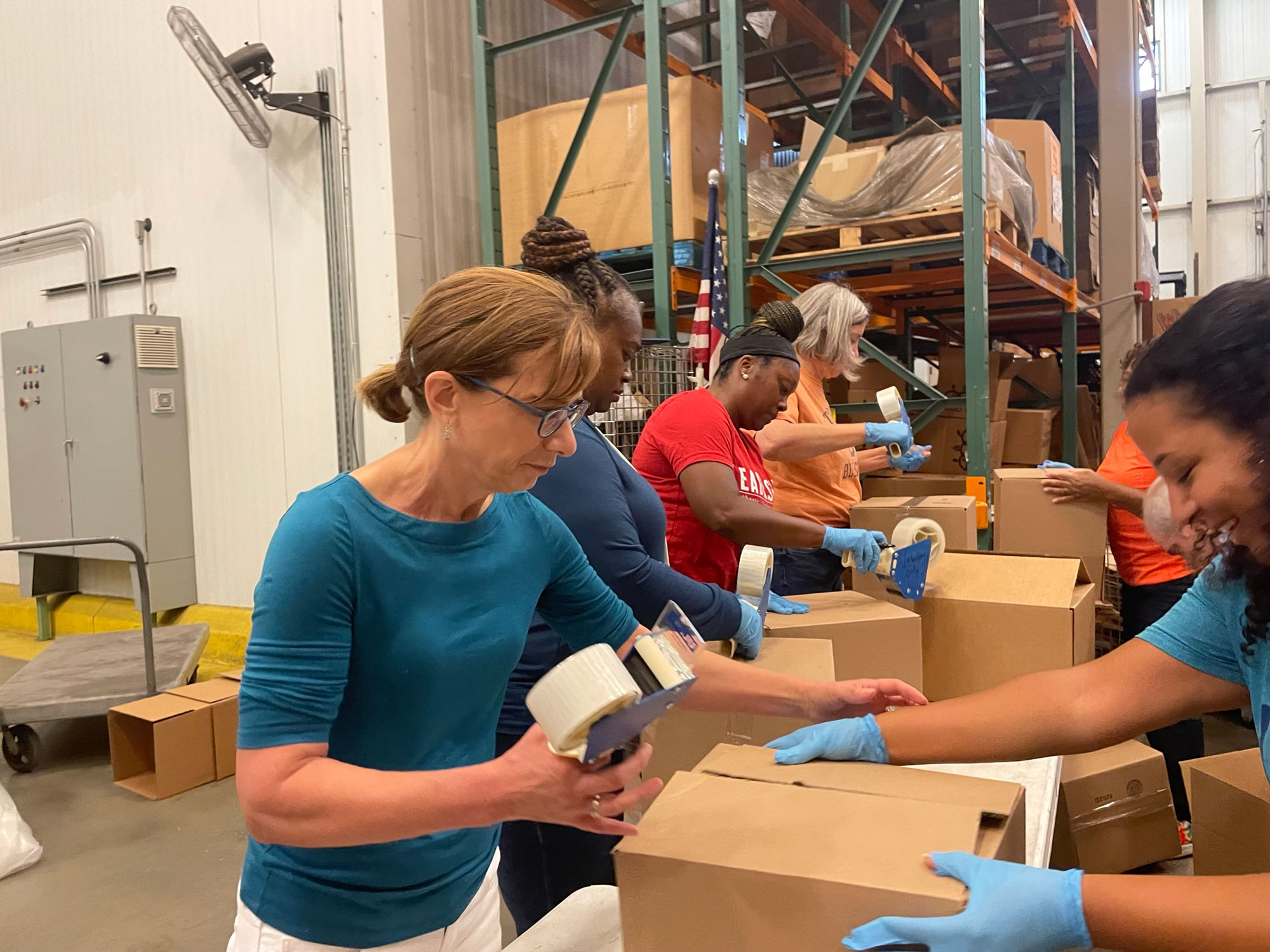 Cindy Long, USDA Food and Nutrition Services Administrator, saves food donation boxes to distribute to area families.