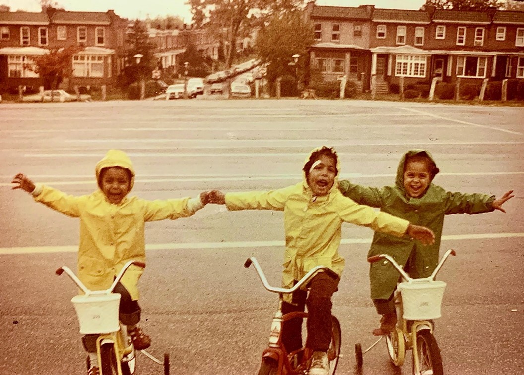 Dr. Sara Bleich pictured (left) at age 4 with her twin sister (right) and older brother (middle)