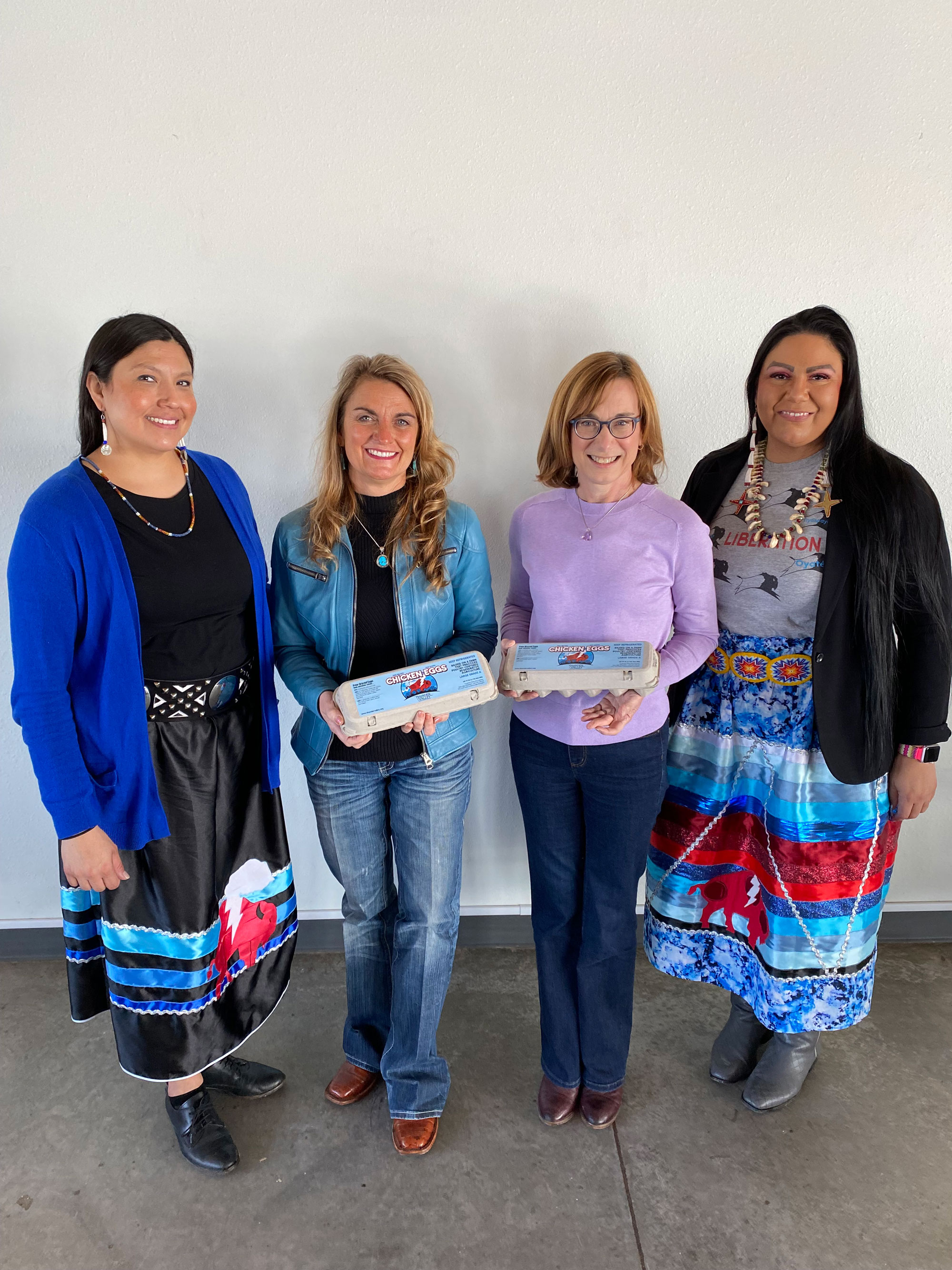 (left to right) Thunder Valley Executive Director Tatewin Means, FNS Mountain Plains Regional Administrator Cheryl Kennedy, FNS Administrator Cindy Long and Thunder Valley Deputy Director Lynn Cuny displaying fresh eggs from the Thunder Valley chicken coop