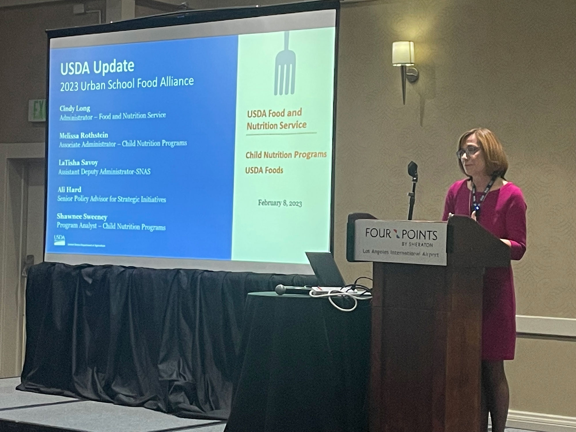 FNS Administrator Cindy Long speaks behind a podium at the Urban School Food Alliance’s winter meeting in Los Angeles, California