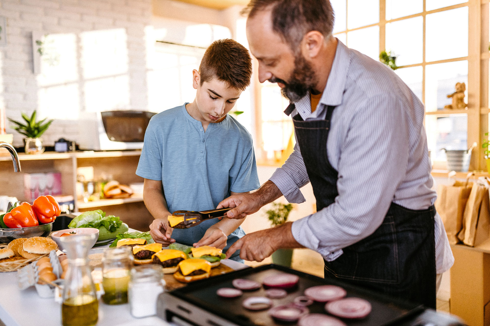 A father with his son cooking together