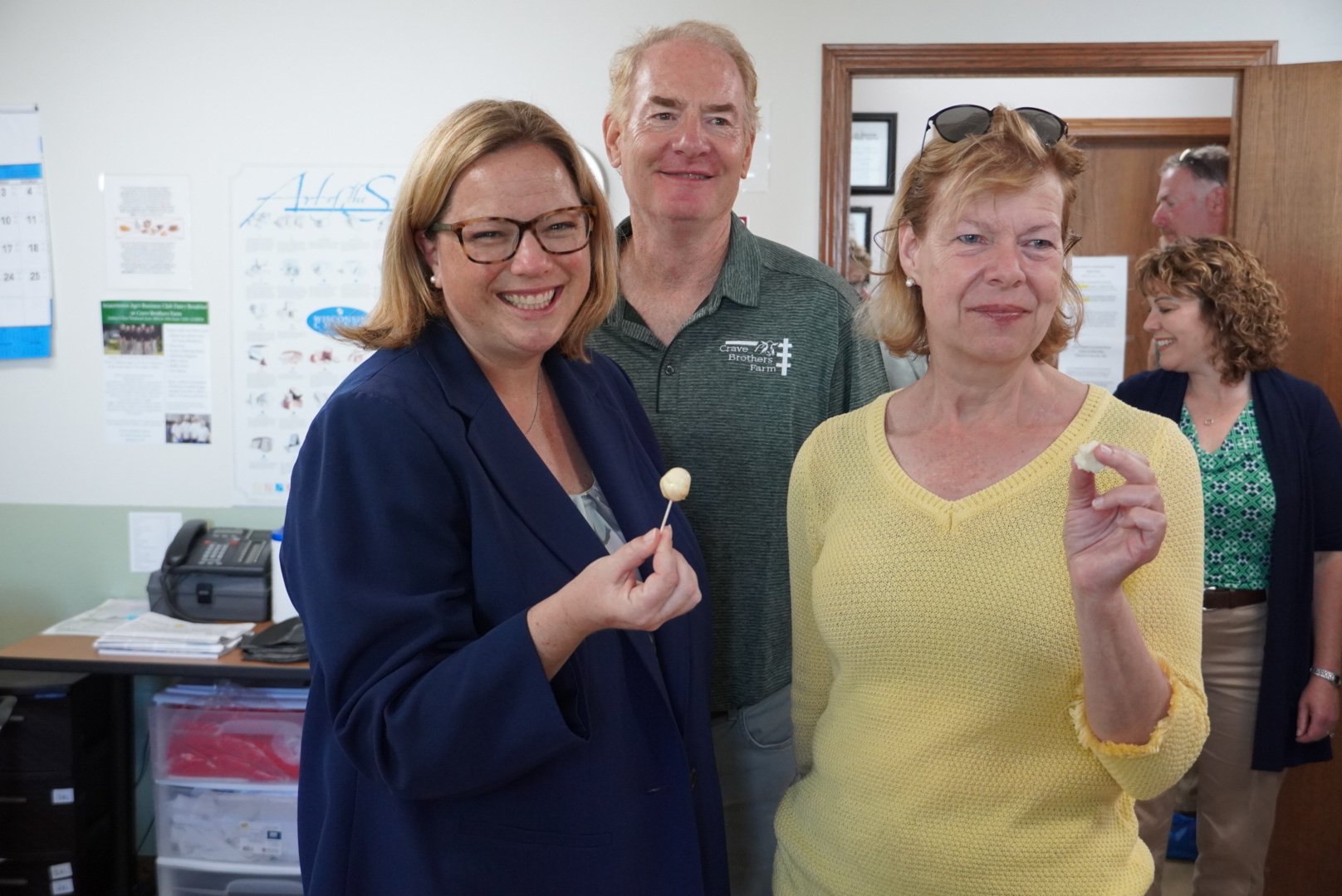 USDA Under Secretary Jenny Lester Moffitt and U.S. Senator Tammy Baldwin sampling the cheese at Crave Brothers Farmstead Cheese, with owner George Crave in Waterloo, Wisconsin