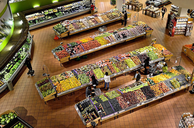 The fresh produce aisle of a Schnucks grocery store with colorful fresh  fruits and vegetables ready to be purchased by consumers. Photos