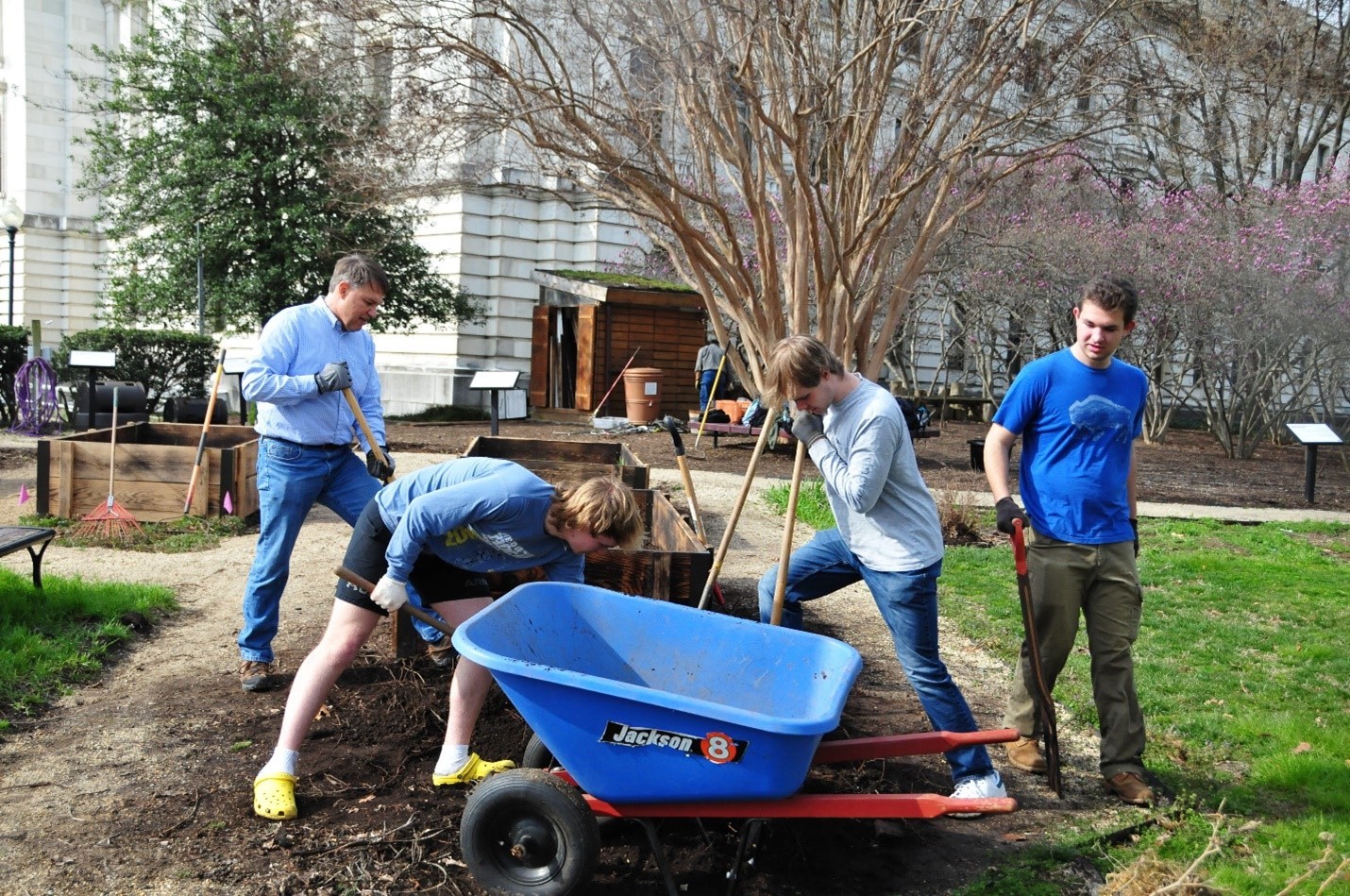 Broadneck High School Students help weed, redistribute soil, and prepare the garden beds for planting in March 2022
