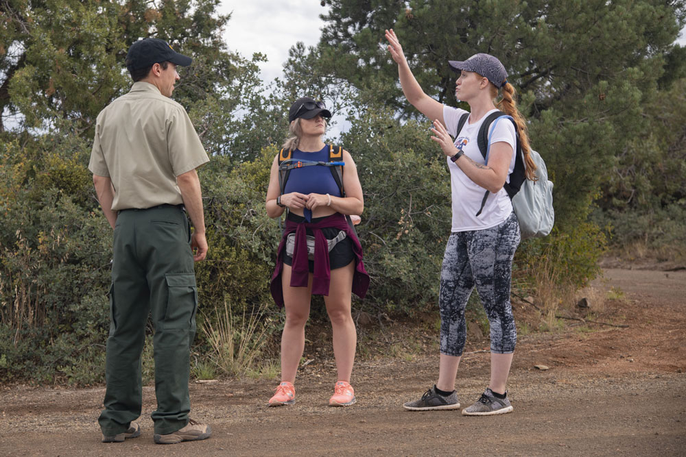 Forest Service project manager talks with hikers about their experience with the permit process and about their use of the trail in Tonto National Forest in Arizona