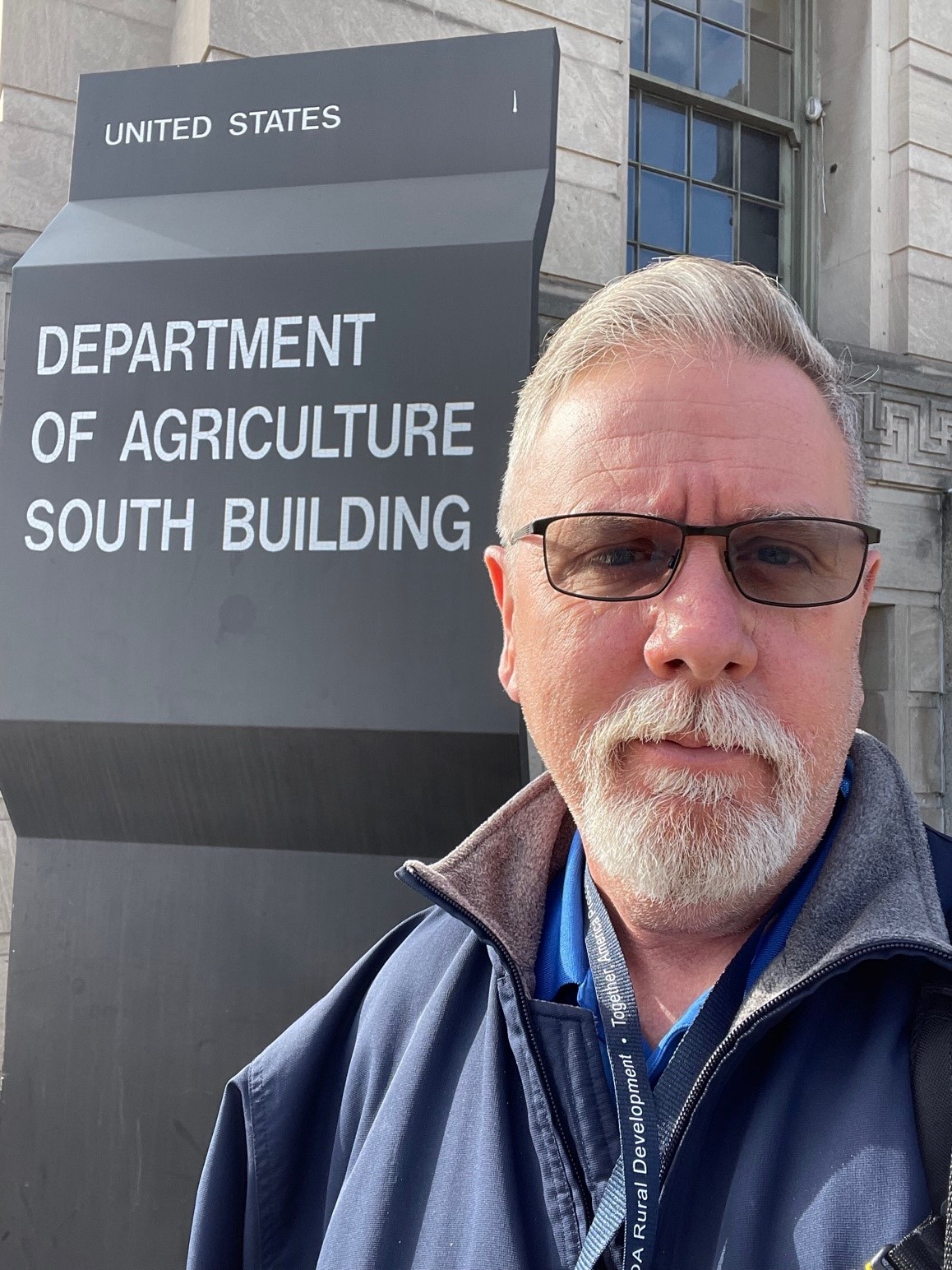 Michael Reese in front of the USDA South Building entrance