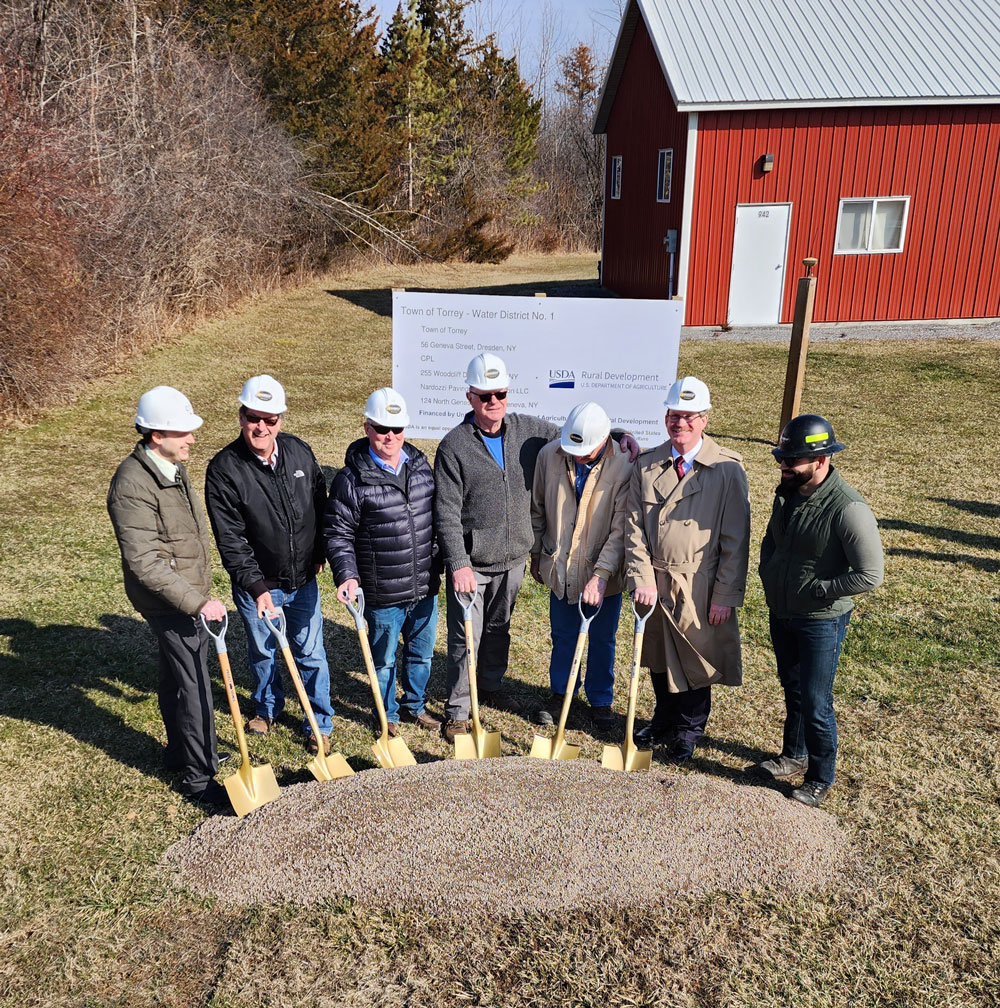 Community representatives from the Town of Torrey and USDA staff pause to break ground on the town’s first-ever Water District