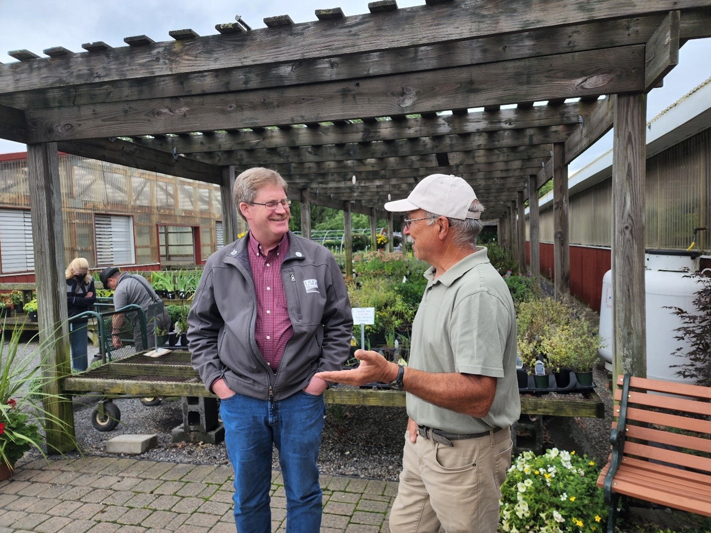 USDA Rural Development New York State Director Brian Murray standing with Peter Ferrante of Wallkill View Farm