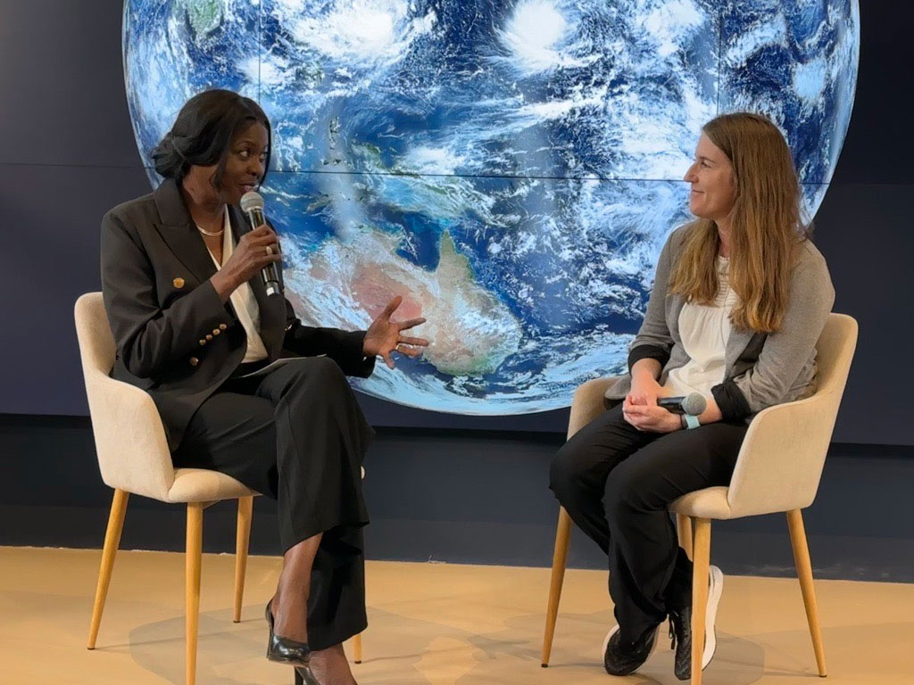 Dr. Chavonda Jacobs-Young at COP28 talking to another person