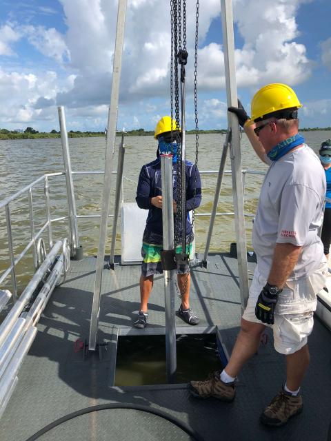 Soil Scientists Greg Taylor and Martin Figueroa coring the Banana River