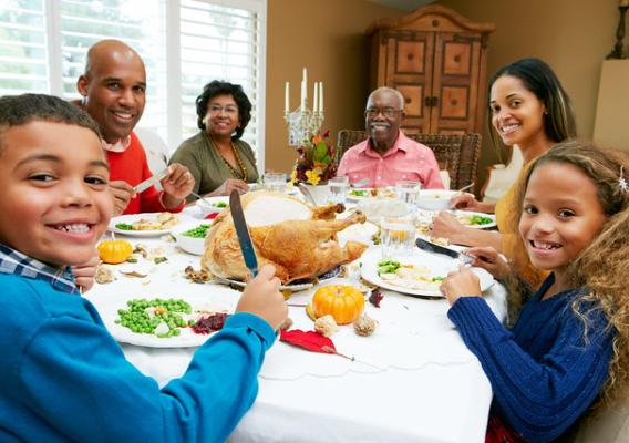 A family sitting down to Thanksgiving