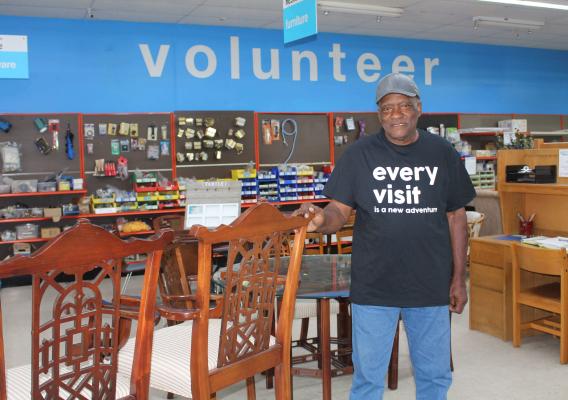 Richard Norman inside a hardware store volunteering