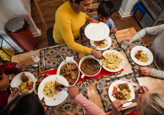 A family observing Ramadan at the table with a meal