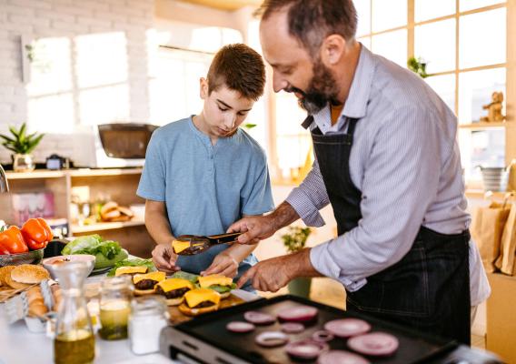 A father with his son cooking together