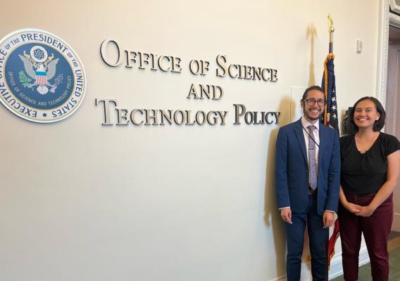 Haley Case-Scott (right) and Julian Reyes (left) in 2023 beside the OSTP sign