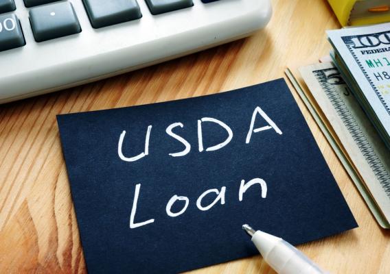 Handwritten inscription USDA Loan on post-it note