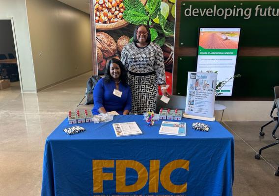 FDIC employees staff an information booth at the Path to Prosperity event at the Northwest Missouri State University in Maryville, MO on April 24