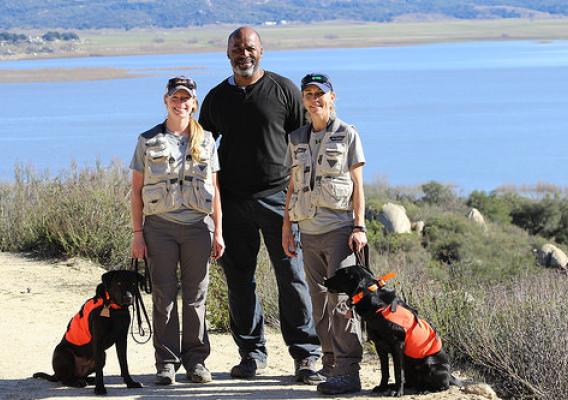 Canine handlers and a training specialist with APHIS detector dogs