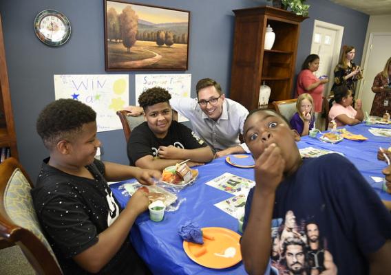 FNCS Acting Deputy Under Secretary Brandon Lipps enjoying a moment with kids during lunch service
