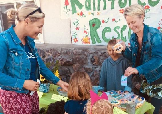 Parents and children at the Salida Montessori Charter School’s rainforest bake sale