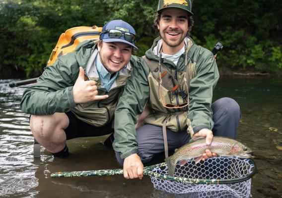Dan Eiden and Theodore Benjovsky on a small river in the Olympic National Forest