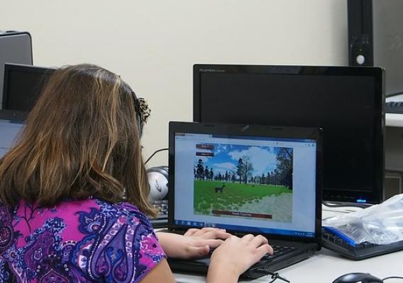 A student playing one of the 7 Generation Games
