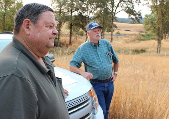 Jeff Baxter (left) and David Chain reviewing the conservation plan