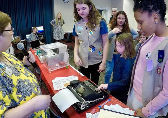 Girl Scouts trying old technology at a USDA Women in Ag STEM panel and demonstration