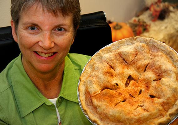 Last Chance Café manager Peggy Tobin shows off a homemade apple pie baked by a volunteer co-op member. 