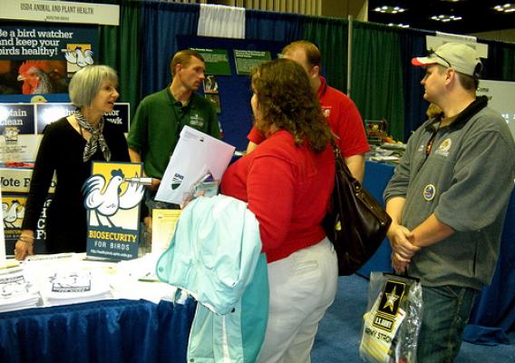 Visitors explore the APHIS booth at the National FFA Convention