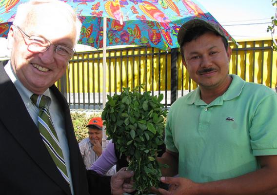 USDA Under Secretary Kevin Concannon poses with one of the many Maryland farmers (no name available) selling fresh produce at the Crossroads Farmers’ Market in Tacoma Park, Maryland, Wednesday October 13.